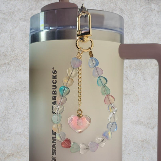 Deluxe Crystal Heart Beaded Tumbler Charm. 
Iridescent Pearlescent Pink Crystal Heart Beaded Tumbler Charm. 

Beads are multicolored. There are 3 styles so please reference the image linked to the style number when choosing. 