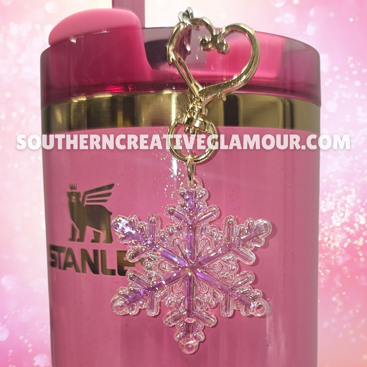 Pearlescent Pink Snowflake tumbler straw charm with gold heart clasp. Taken with flash. 