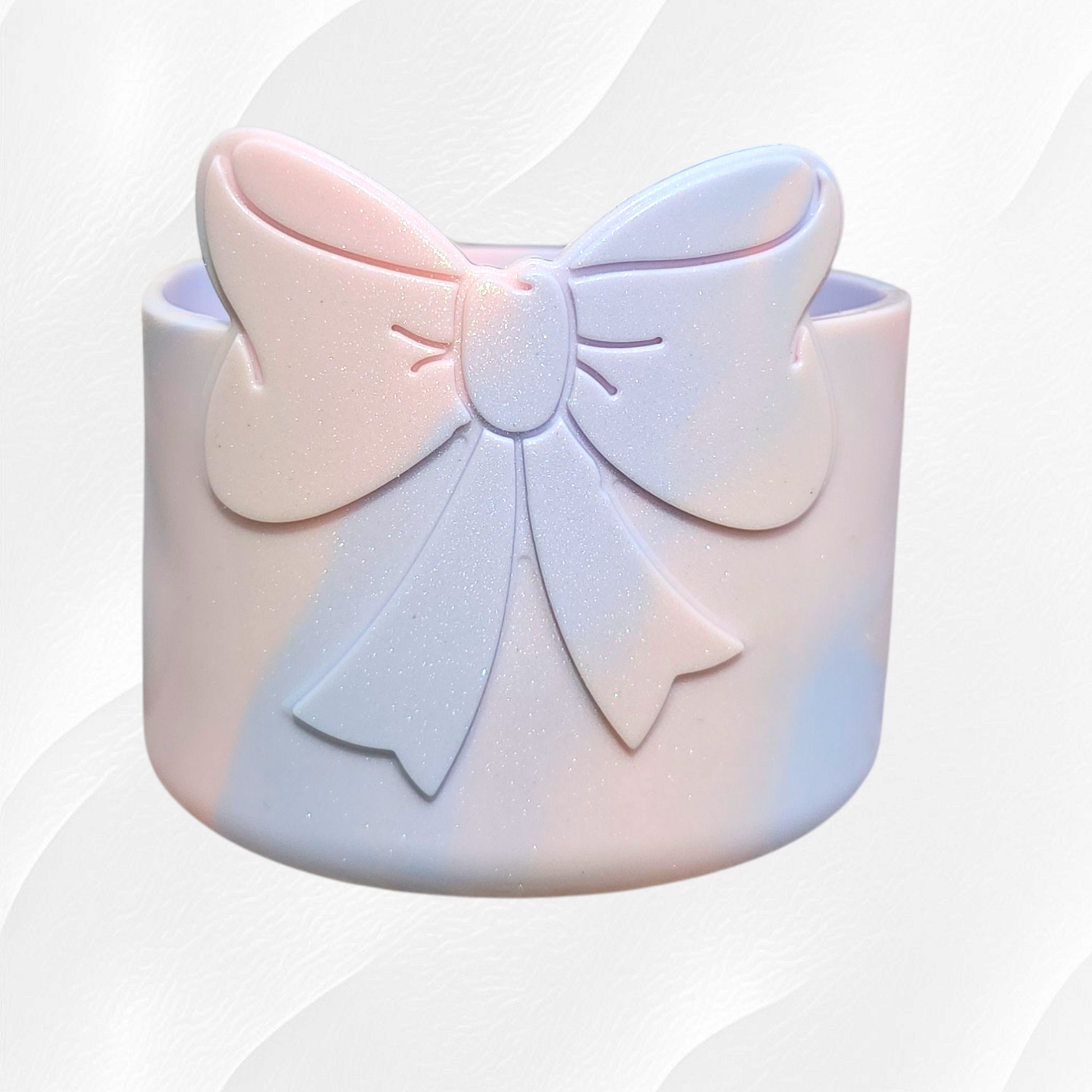 Light peachy pink and periwinkle blue shimmery Bow Silicone Tumbler Boot. 
Cotton Candy Shimmer Tumbler Boot by Southern Creative Glamour 