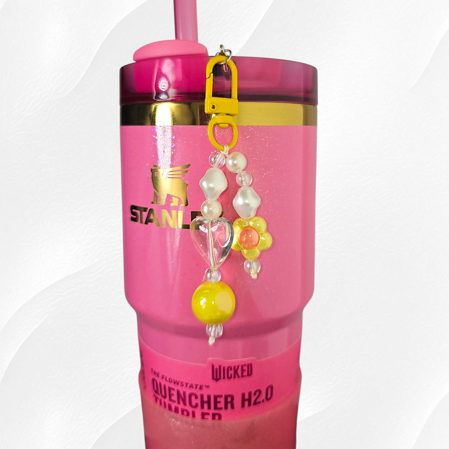 Yellow flower and heart charm. 