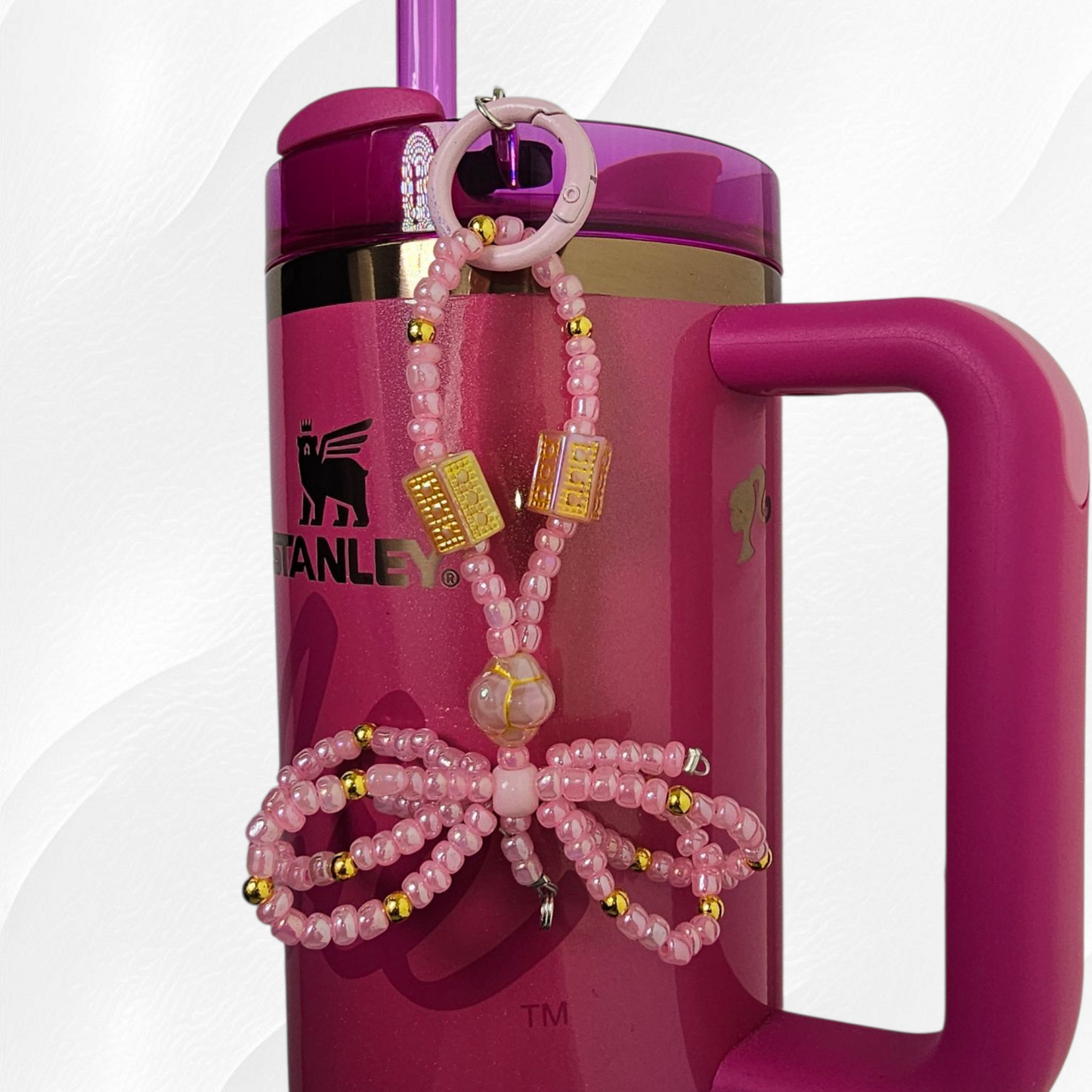 Egyptian themed pink and gold beaded ribbon bow charm. 