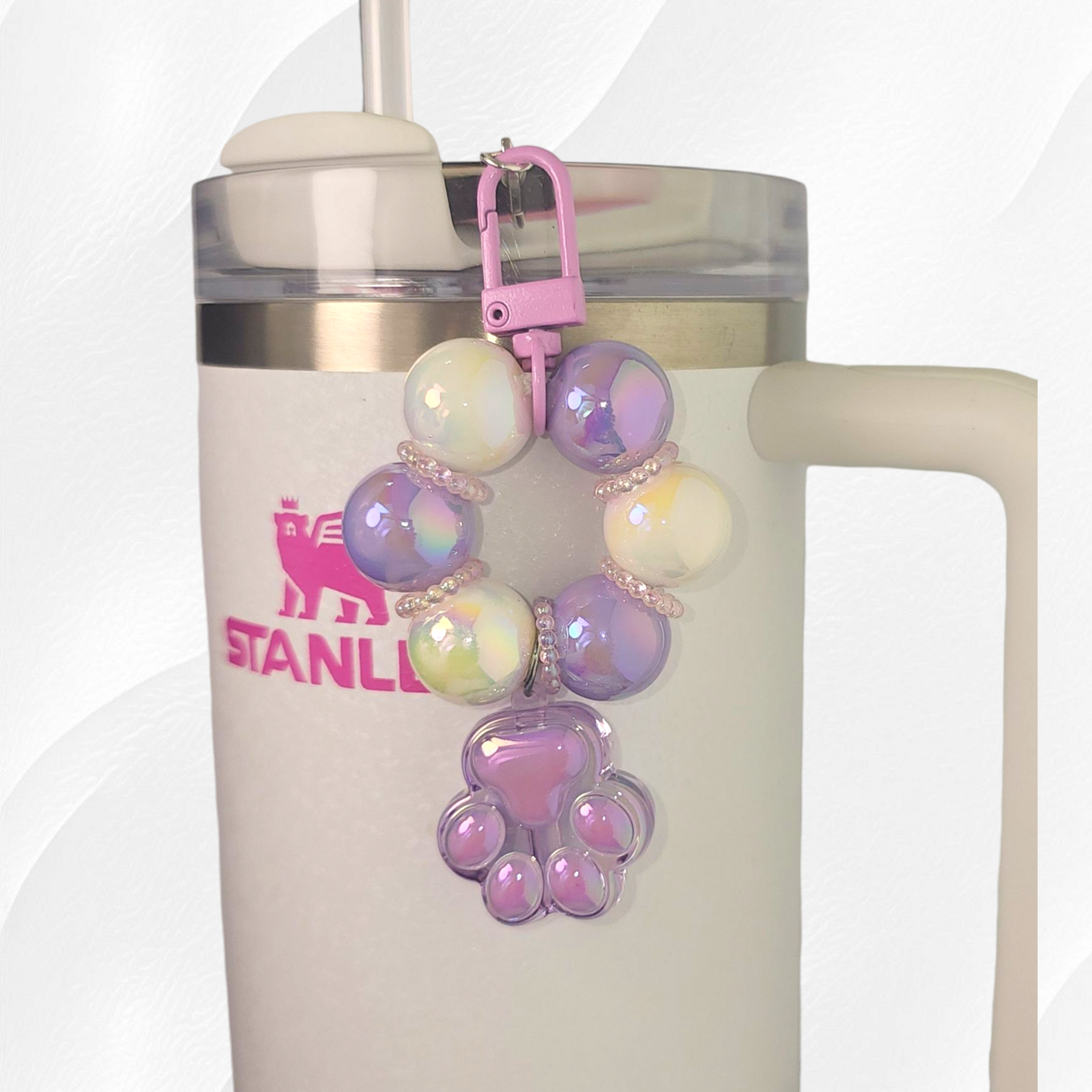 Purple beaded paw print tumbler straw charm. 