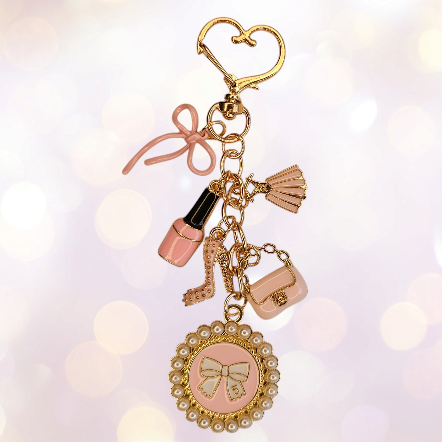 Luxury tumbler straw charm dangle for the classy Diva. 

Colors are gold, white, and pink. 

Charms consist of pink fingernail polish, glitter high heel, white pearl #5 bow, pink bow, and pink dress. 