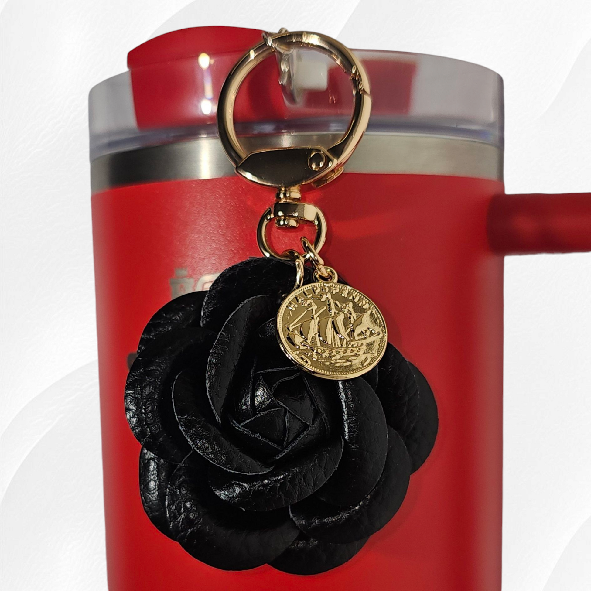 Black Camelia flower with gold swivel keyring tumbler charm. 