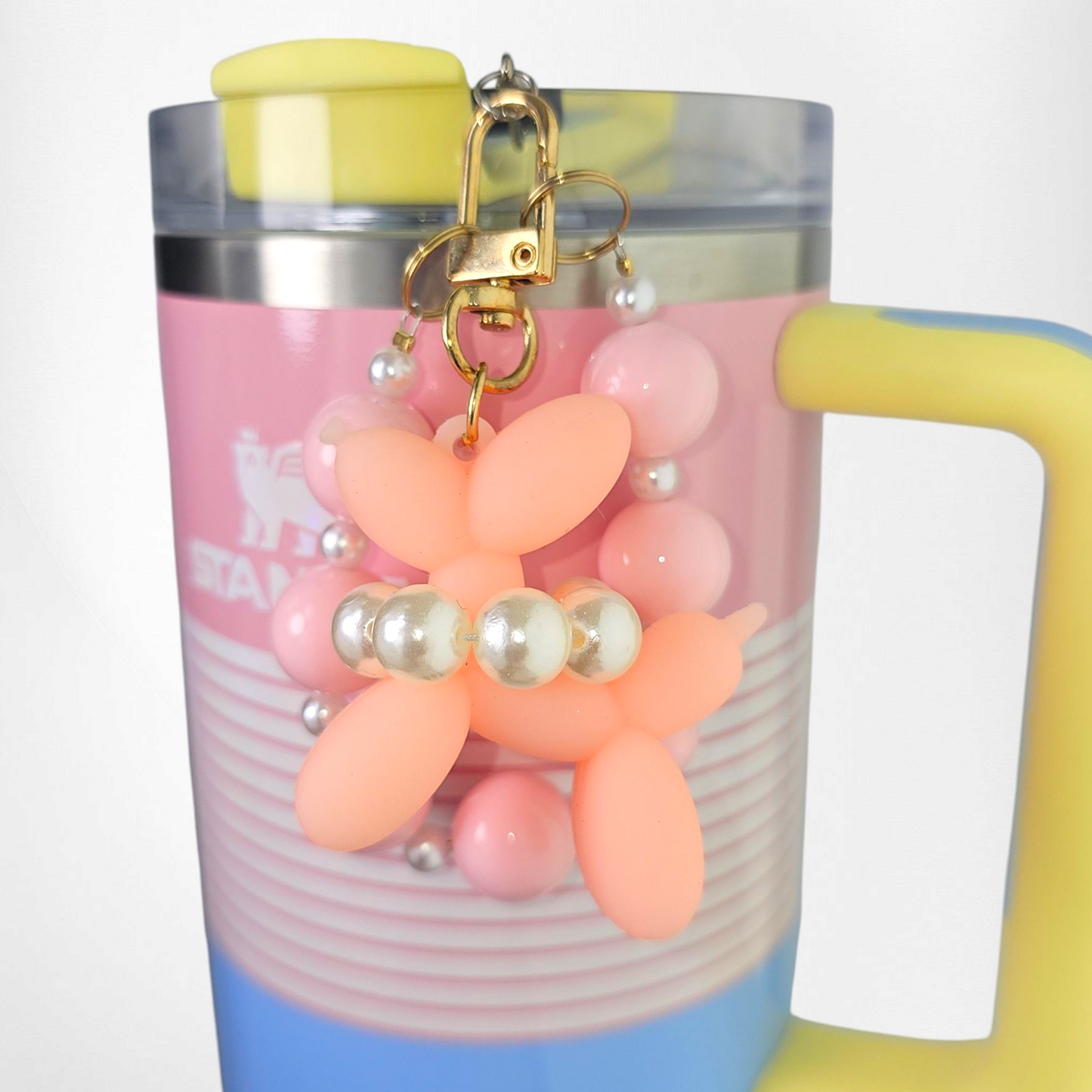 Pink Balloon Dog wearing a white pearl beaded necklace with a pink beaded charm bracelet. Use as a tumbler, purse, or keychain charm. 