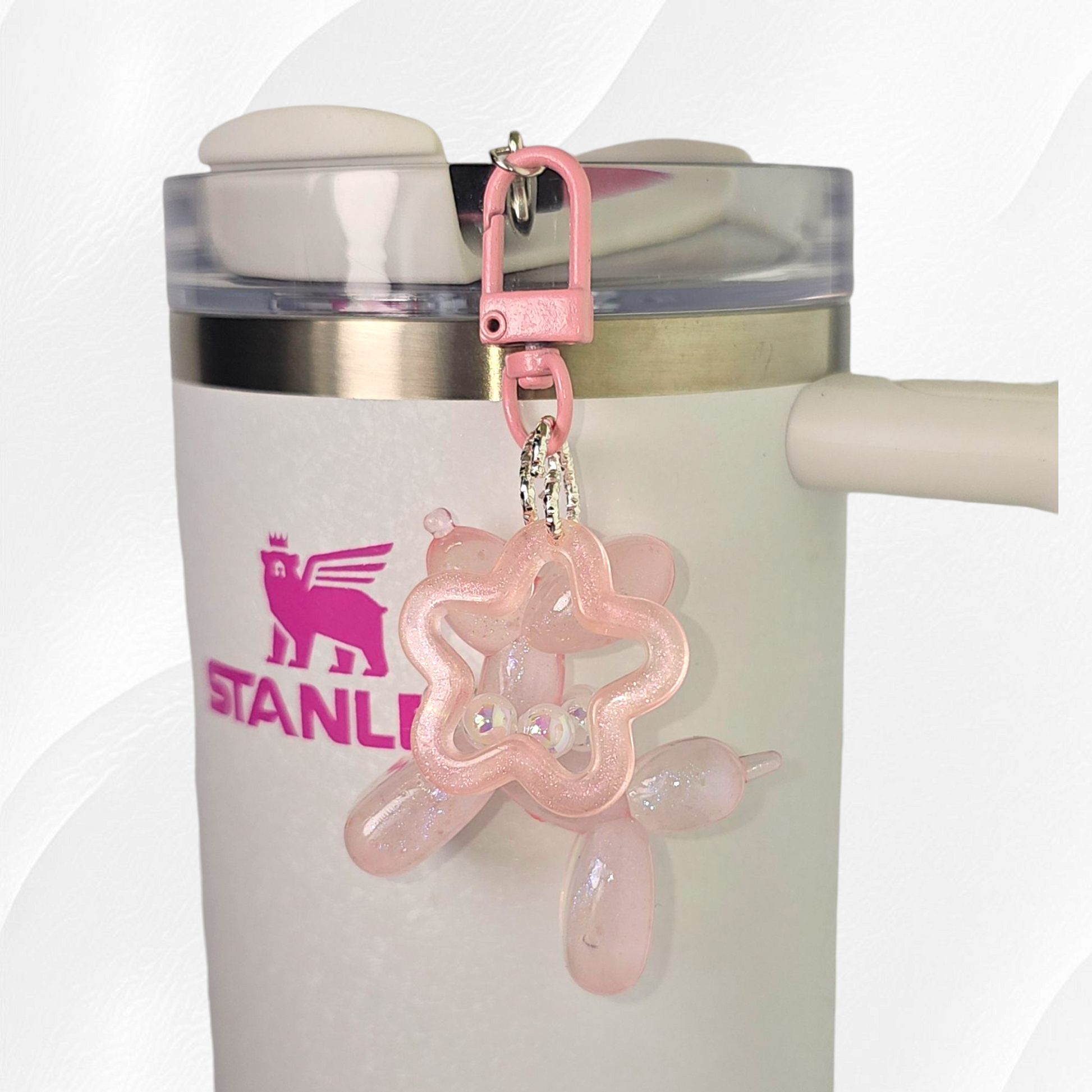 Pink Glow in the Dark Iridescent pearlescent balloon dog and star charm. 