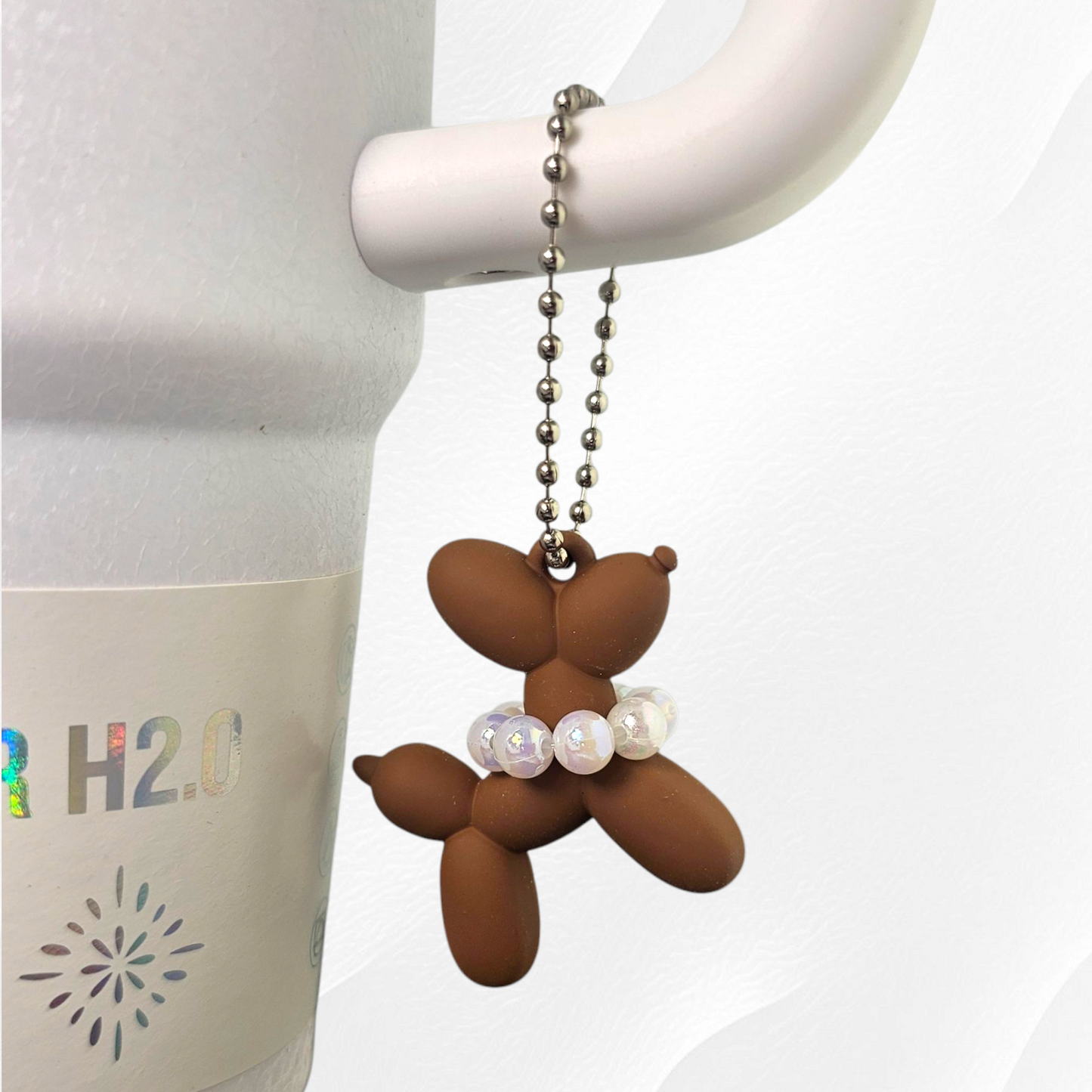 Brown Balloon Dog wearing white pearl necklace cup handle charm. 