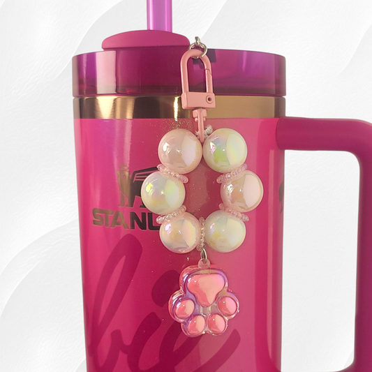 Pink beaded paw print tumbler straw charm. 