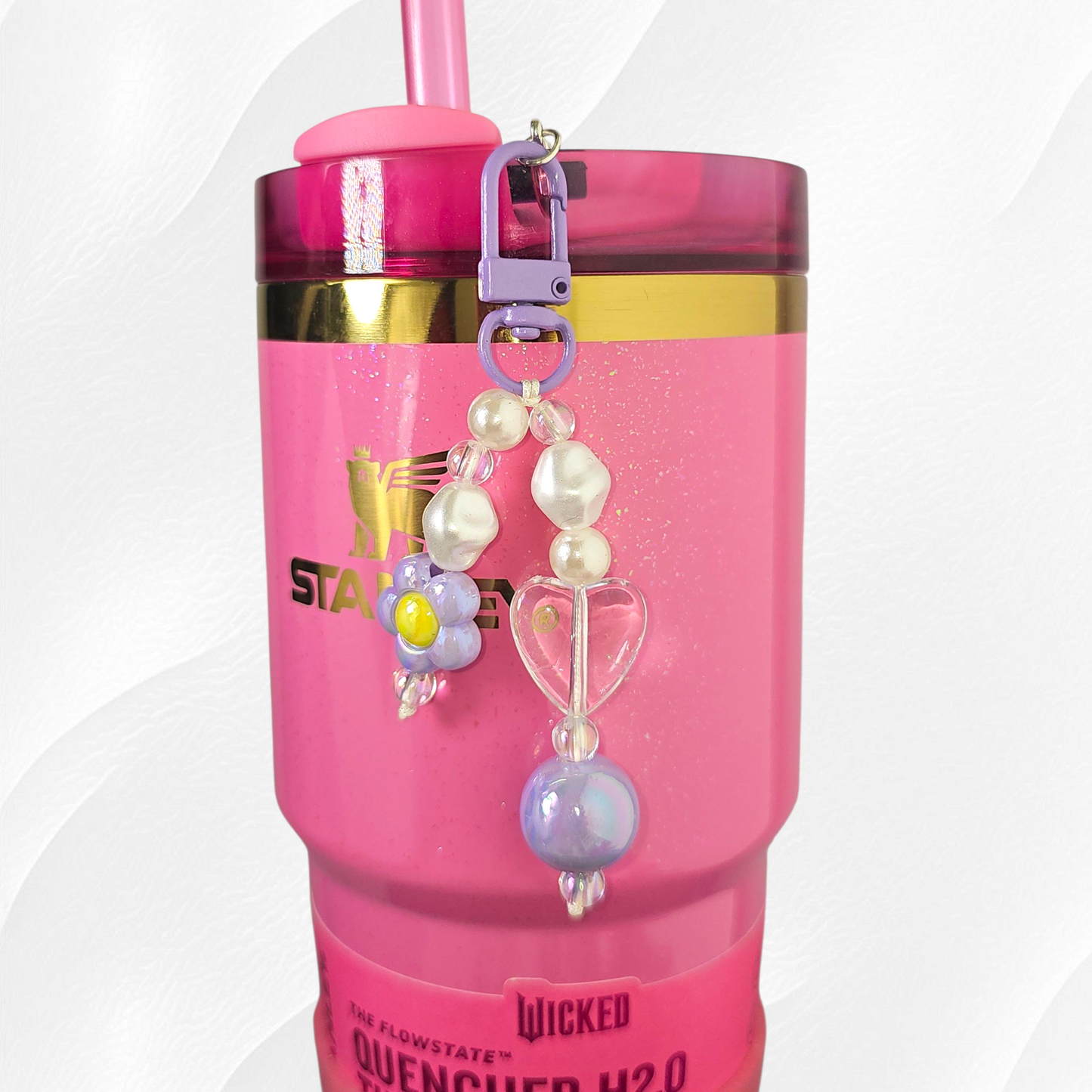 Purple flower and heart charm. 