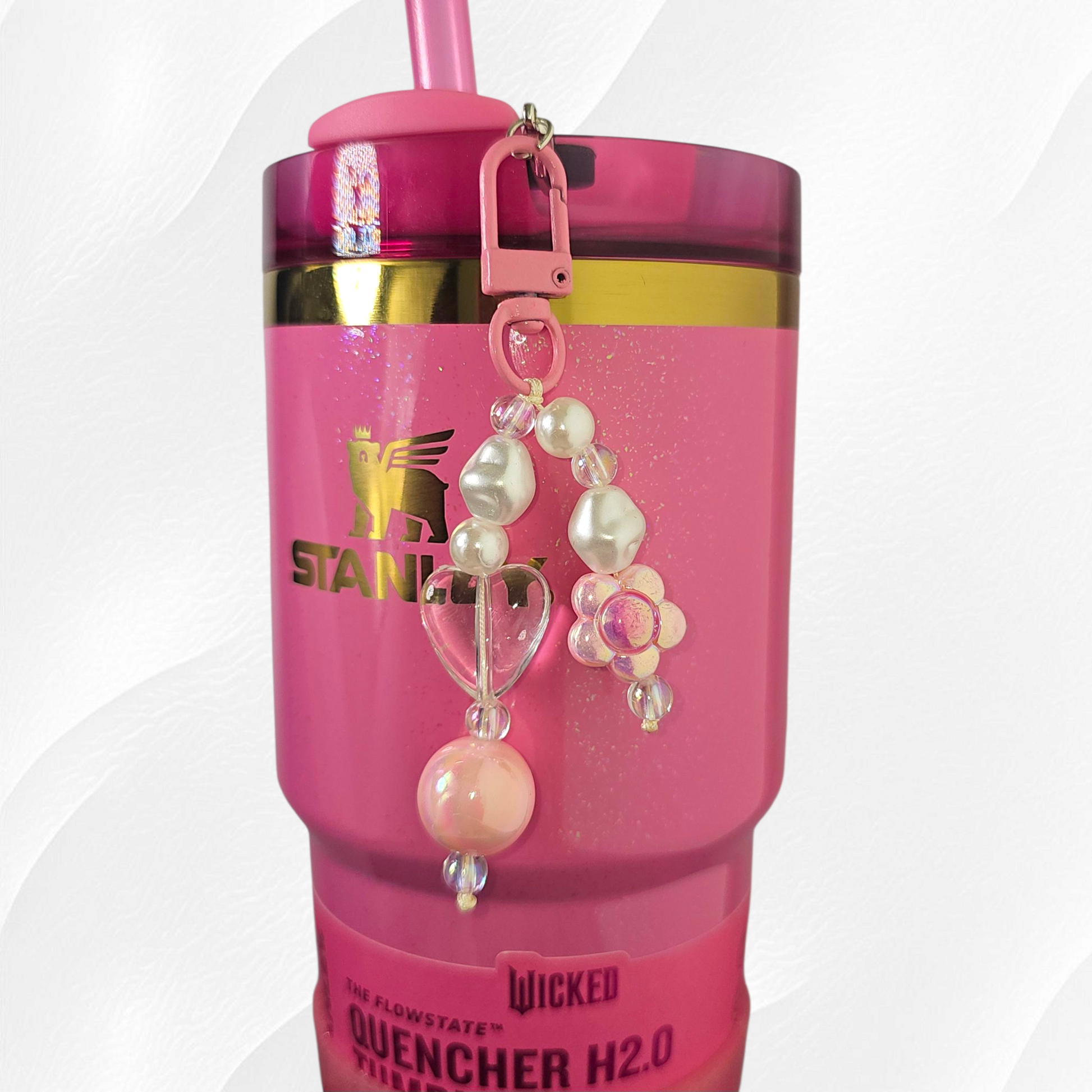 Pink flower and heart charm. 