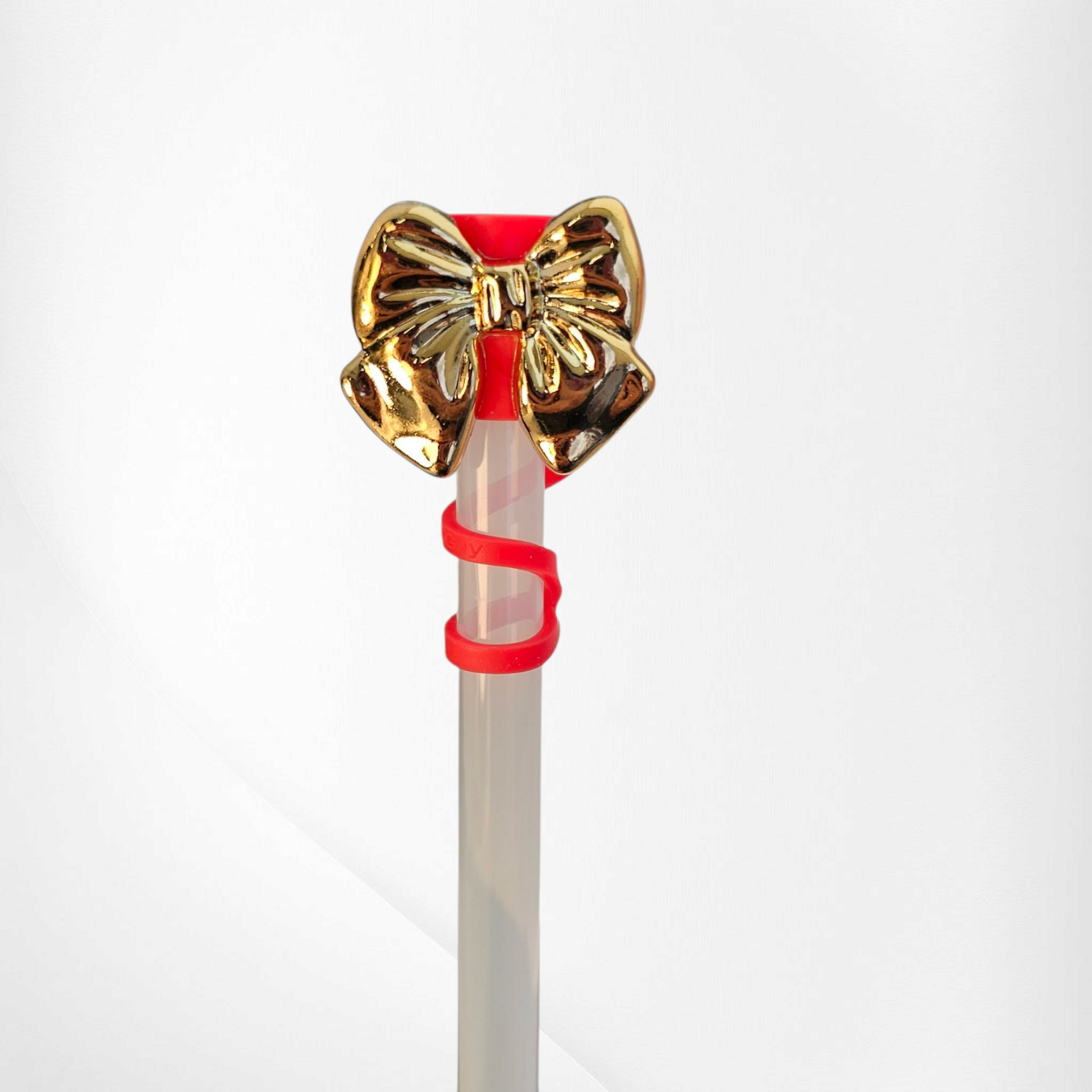 Shiny Gold Bow Silicone Straw Topper. Red straw cap base. 