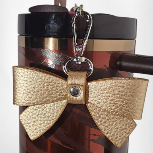 Gold faux leather ribbon bow charm pendant. 