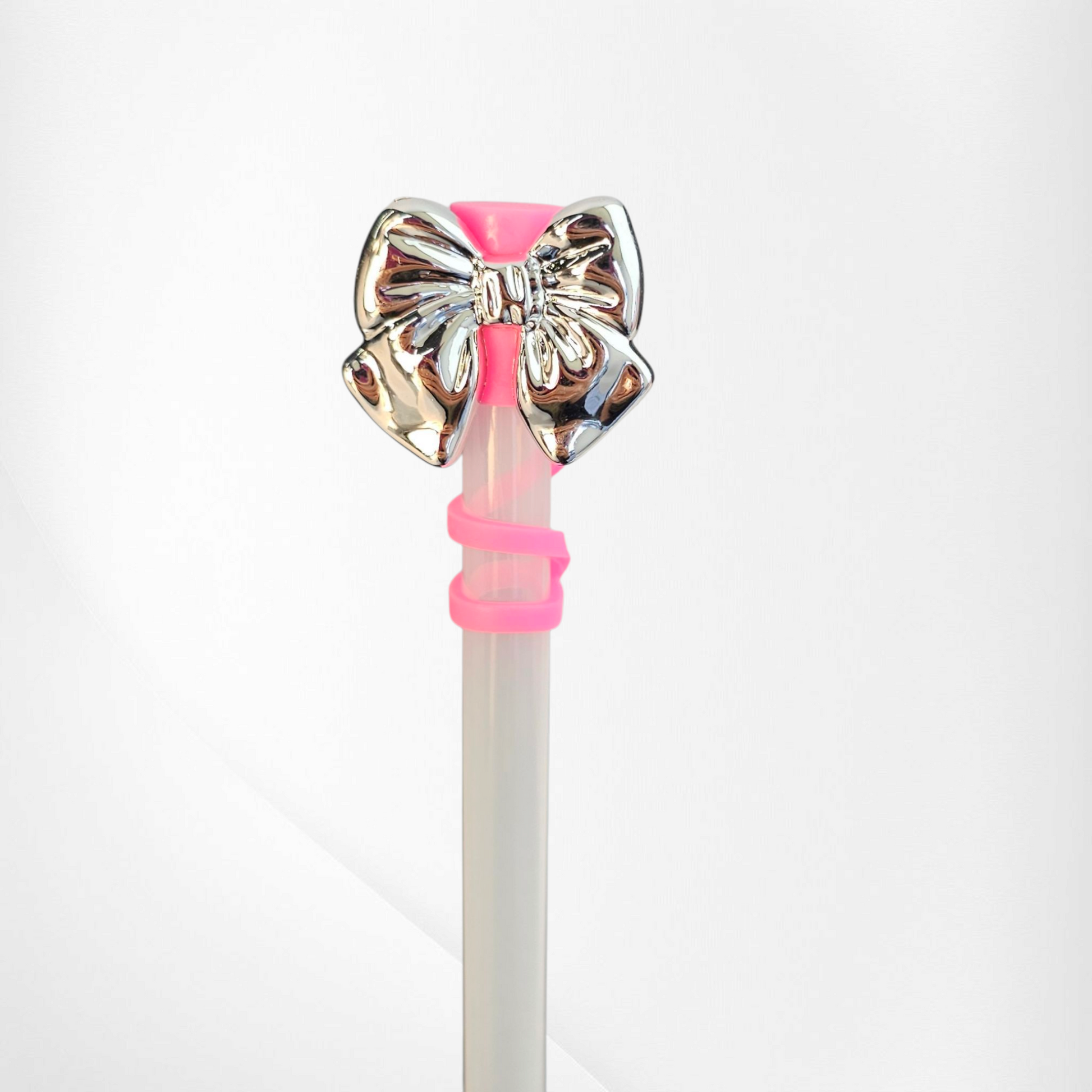 Shiny Silver Bow Silicone Straw Topper. Hot Pink straw cap base. 