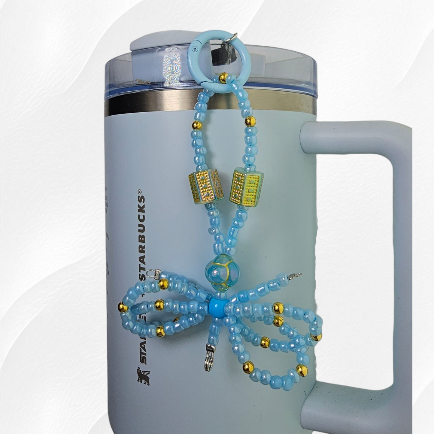 Egyptian themed spring blue and gold beaded ribbon bow charm. 
