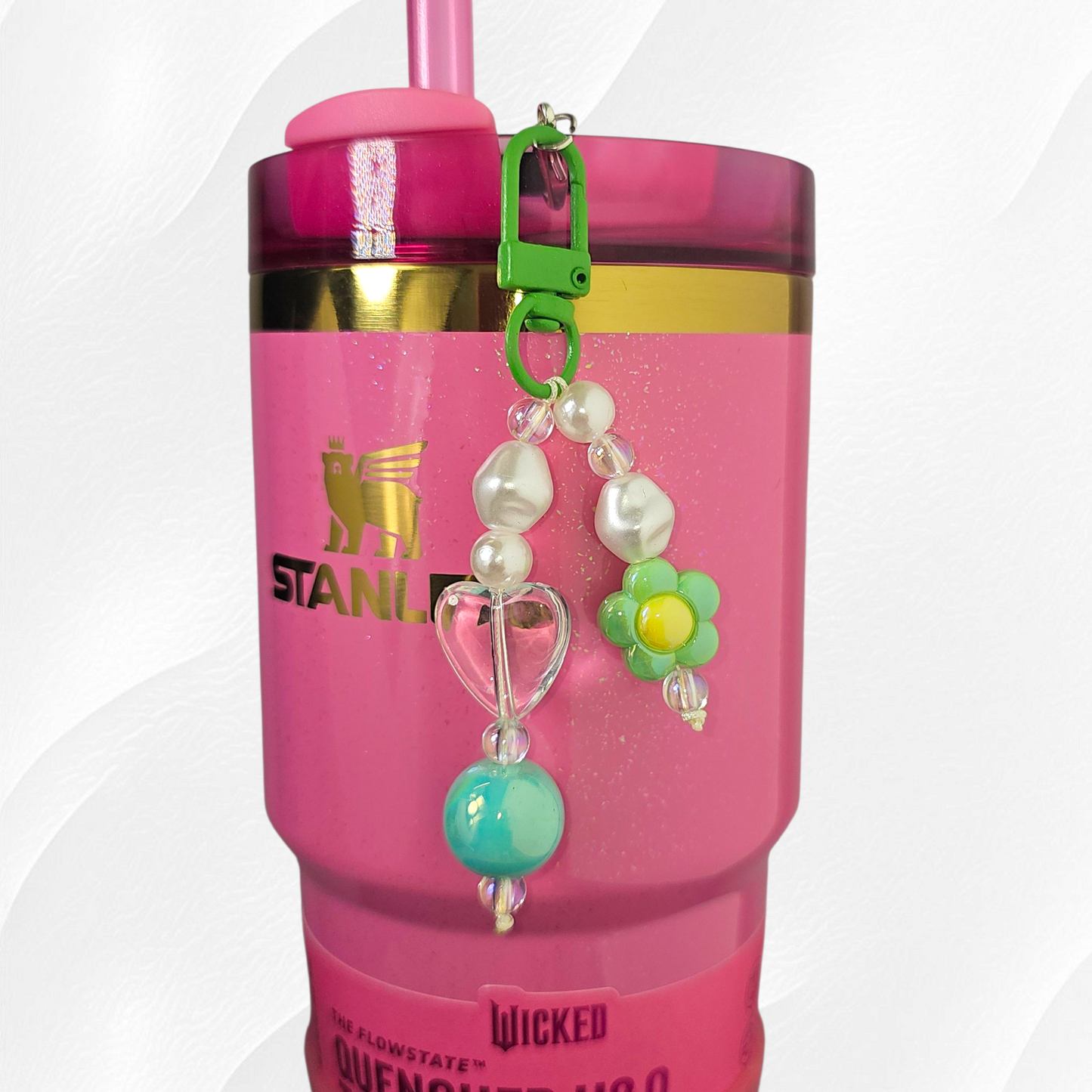 Green flower and heart charm. 