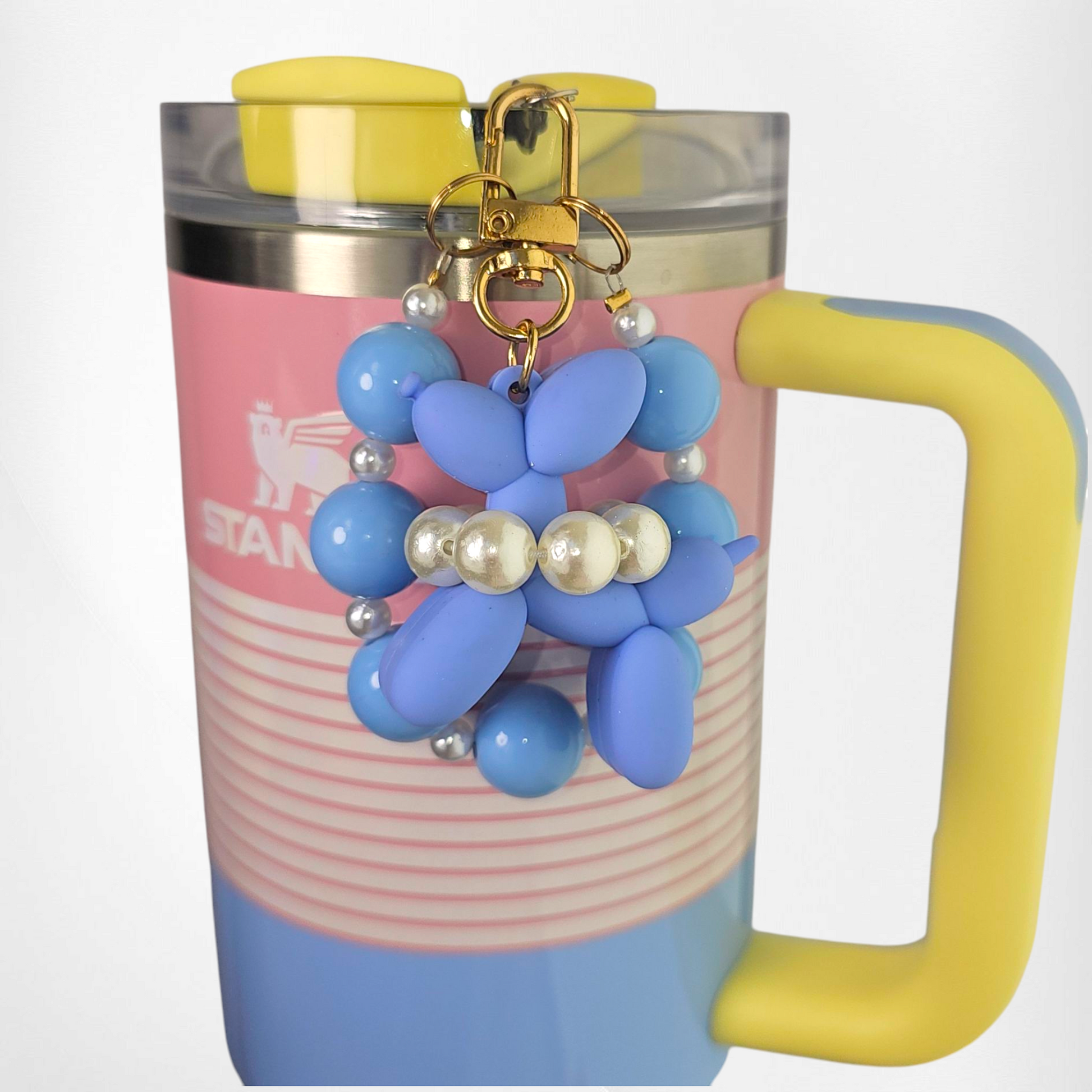 Blue Balloon Dog wearing a white pearl beaded necklace with a blue beaded charm bracelet. Use as a tumbler, purse, or keychain charm. 