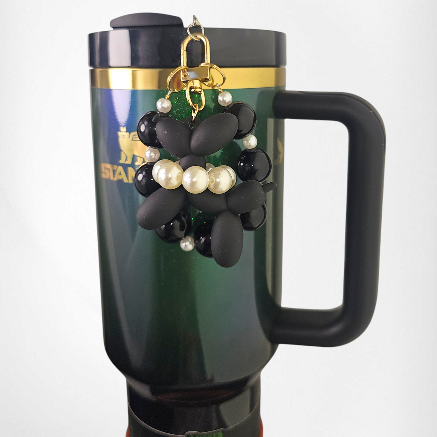 Black Balloon Dog wearing a white pearl beaded necklace with a black beaded charm bracelet. Use as a tumbler, purse, or keychain charm. 