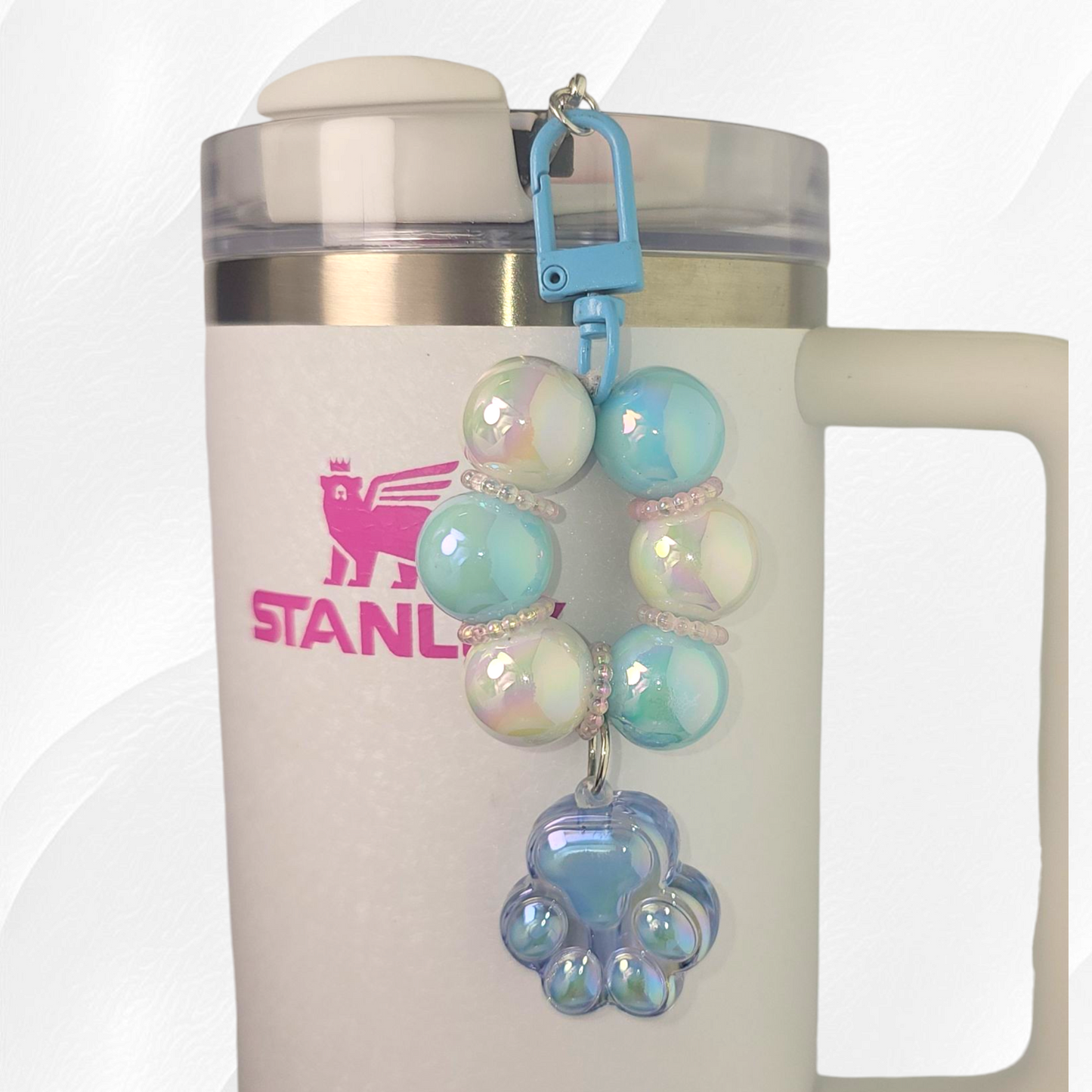 Blue beaded paw print tumbler straw charm. 