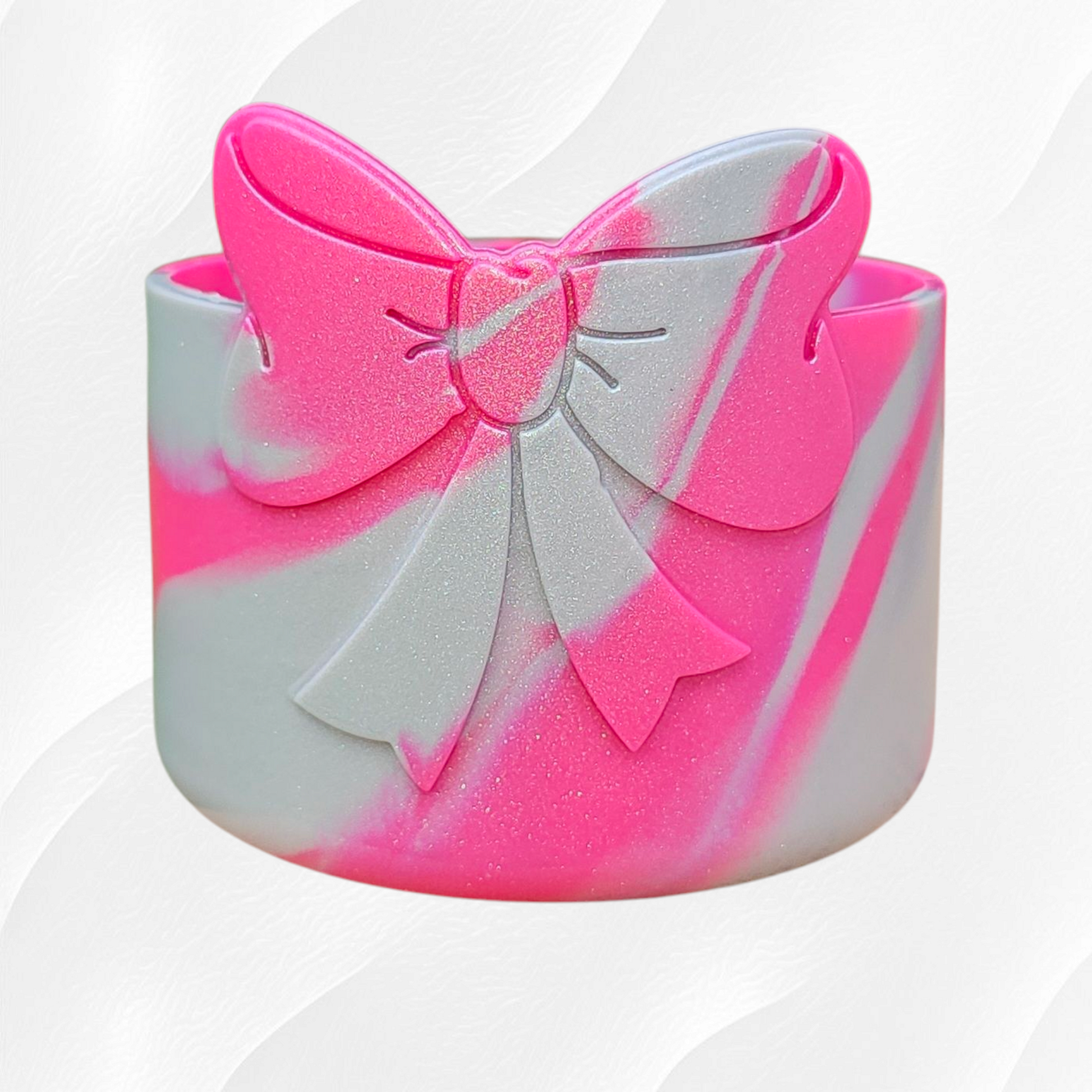 Pink and Silver Shimmer colors swirled on a silicone bow tumbler boot by Southern Creative Glamour 