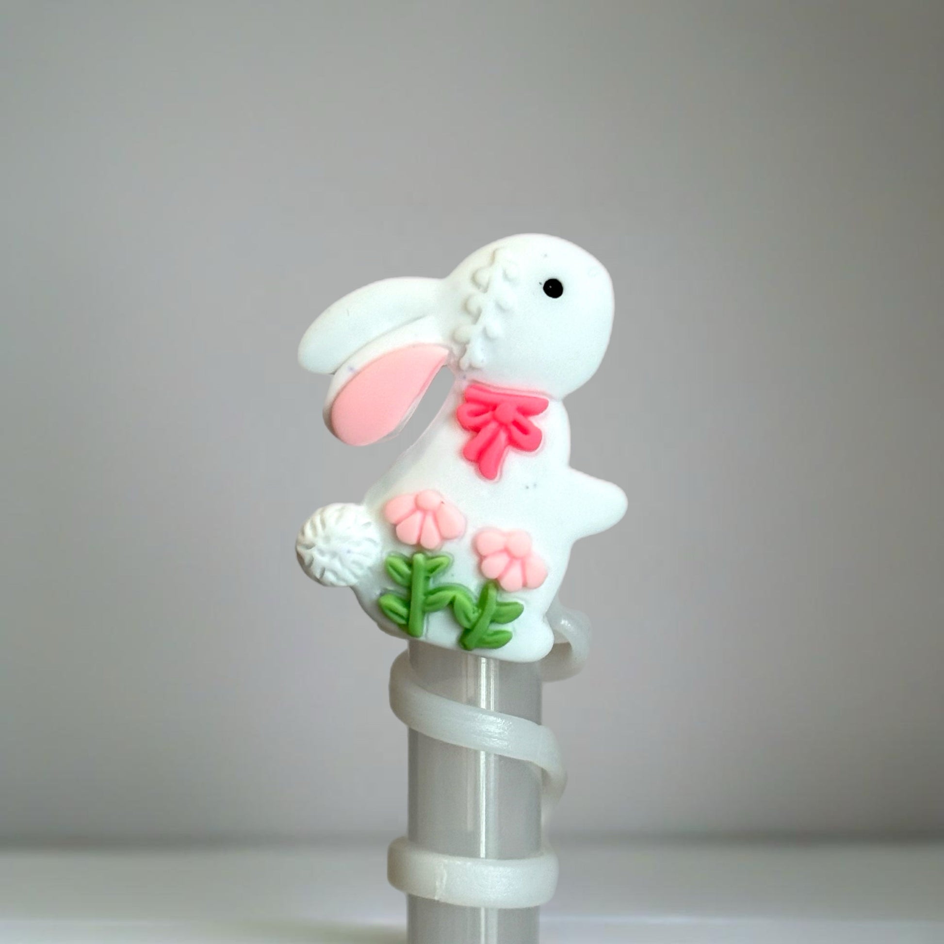 Spring Bunny Silicone Straw Topper with pink bow & floral detail. Fits 10mm straws for Stanley, Simple Modern & more. Perfect Easter tumbler accessory!